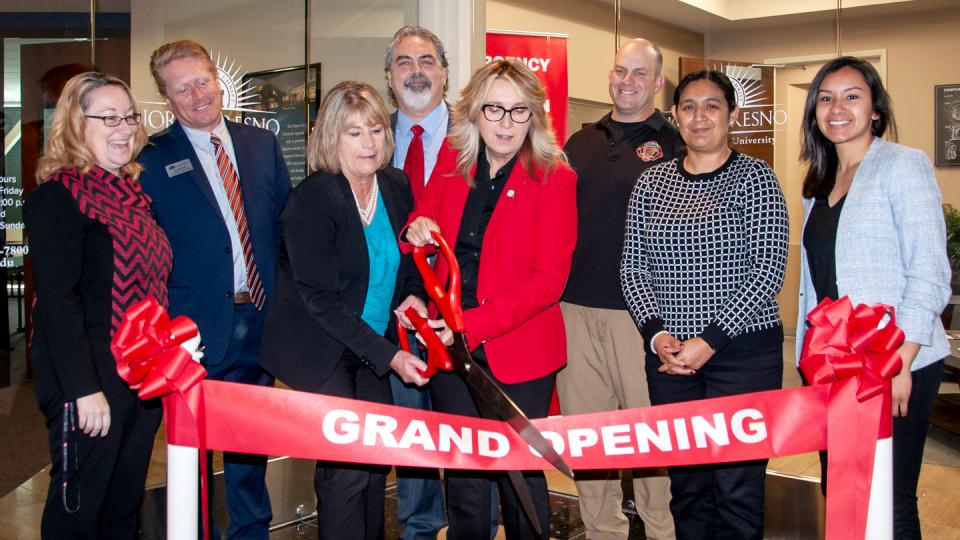 Officials from Fresno Pacific University and Fresno City College cut the ribbon at the new fire academy