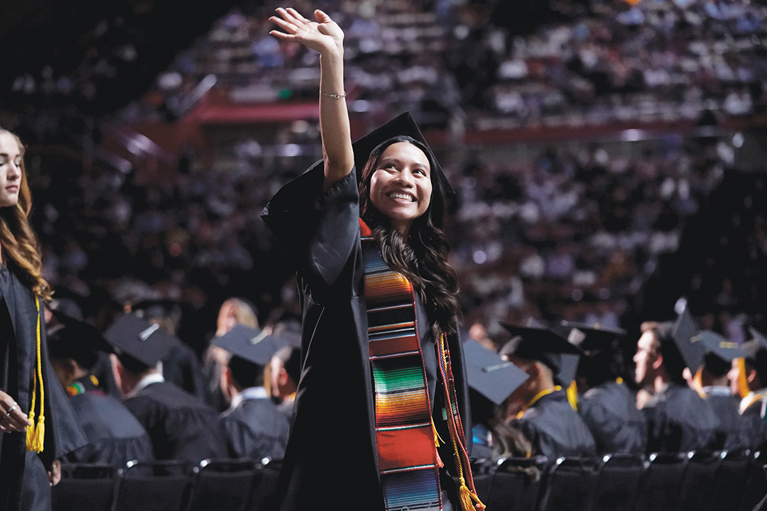 Veronica Mendez waiving with her gown on