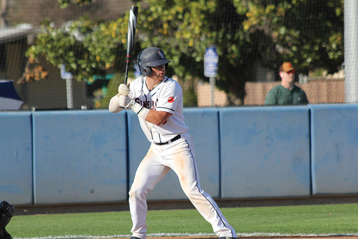 Andrew Valdez holding a baseball bat