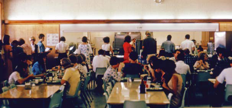 A lot of people lined up in the old cafeteria