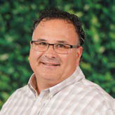 Juan Garza holding a baseball bat