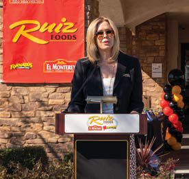 Kimberli giving a speech at a food ceremony