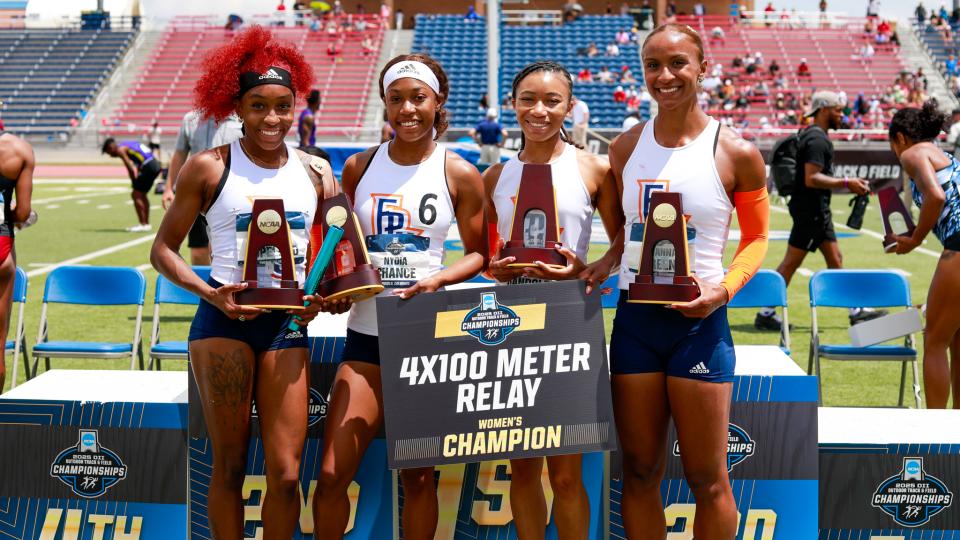 Members of the winning women's 4x100 relay team