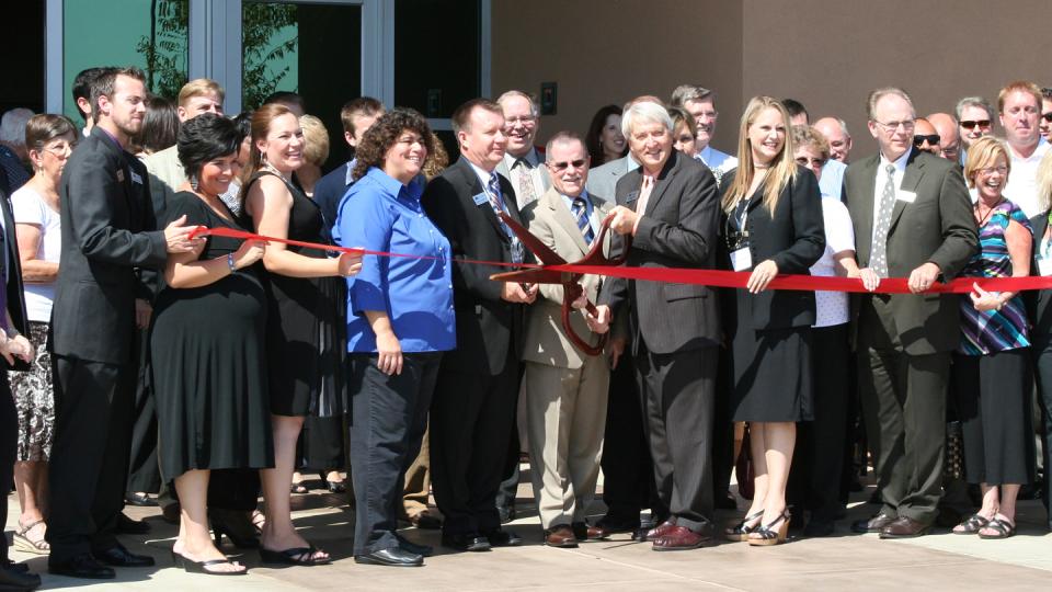 School and city officials gather to cut the ribbon on the Visalia Campus