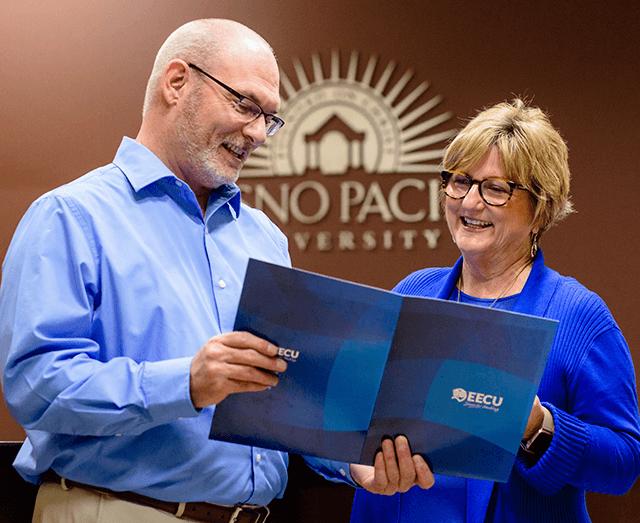 Mike Jones and Vicki Pontius review EECU packet together on FPU campus