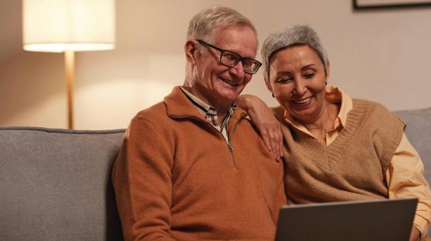 Two elders looking at a computer screen