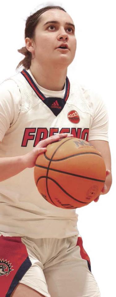 Photo of female athlete playing basketball