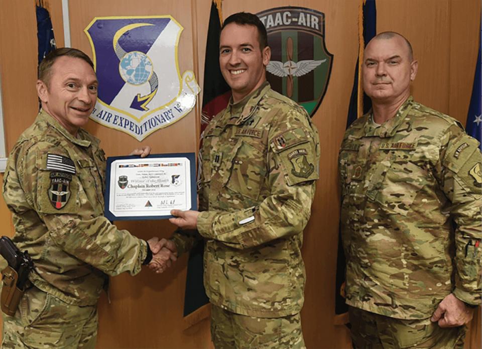 Rob Rose in Air Force uniform receiving award