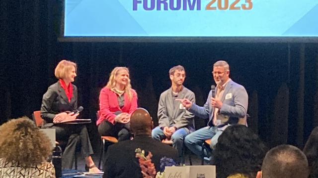 (From left): FPU Business Faculty Suzana Dobric Veiss interviews MaryJo, Viktor and Kenny Burchard at the 2023 Leadership Forum