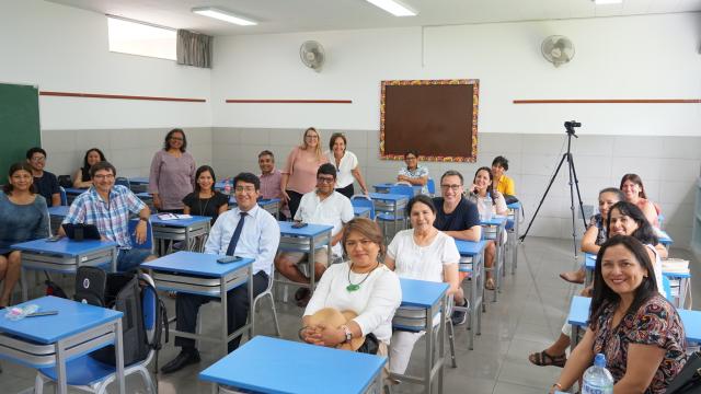 FPU faculty and teachers in a Peru classroom learning about math for social justice