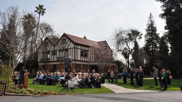 Gathering on Seminary House green for alumnus funeral