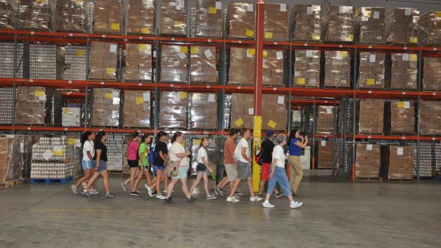 President's Scholars toured the Community Food Bank in Fresno (pictured) and helped city parks staff clean up two of its facilities