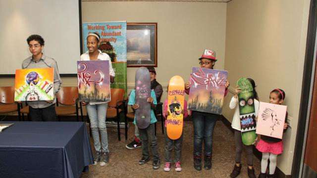 Children receive awards for the Faith-Rooted Social Business Plan Contest