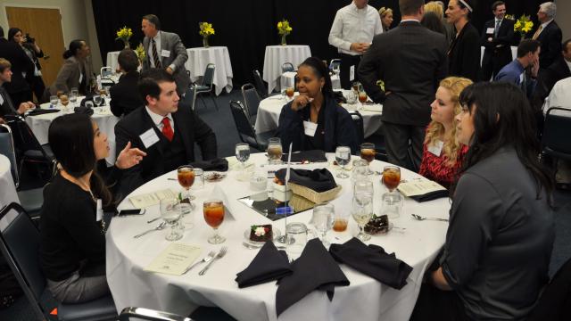 Students at professional luncheon organized by career services