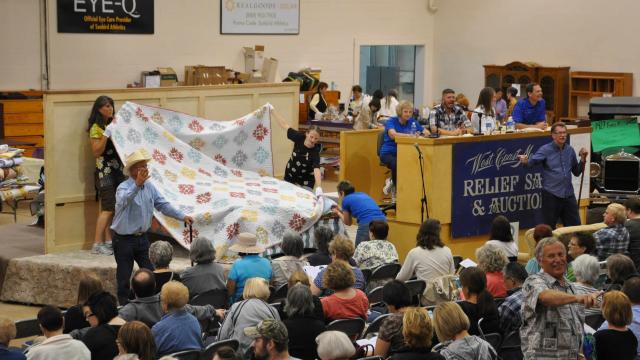 Mennonite quilts auctioned in Special Events Center for MCC Sale