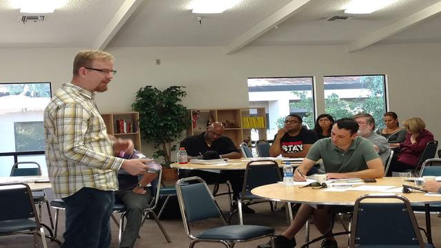 Fresno Pacific University instructor Andrew Shinn teaches a group of participants at the 2018 Social Business Plan Workshop