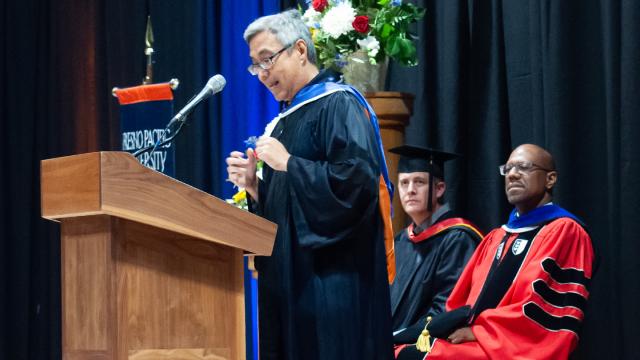 Ken Cheung speaks at the podium during Convocation 2022      