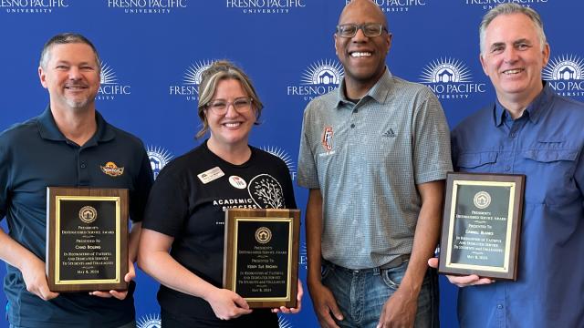 Presidential Distinguished Service Award winners (from left)—Chad Bolling; Kerry Sue Brown, President André Stephens and Darrell Blanks. 