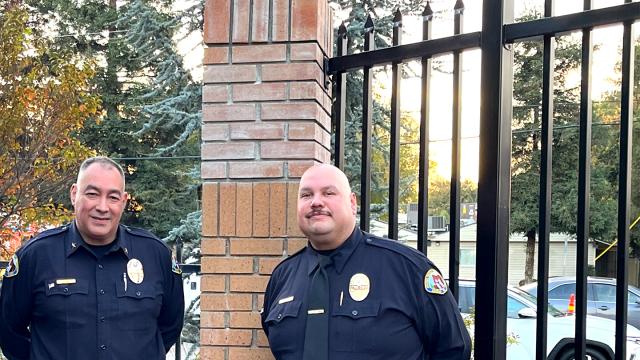 Javier Campos (left), director of campus safety, and Andrew Rodriguez, the campus safety officer who has a written a successful series of grants to fund projects including new fencing around the main FPU campus, at an area where 5-foot fencing is being replaced by 8-foot fencing.