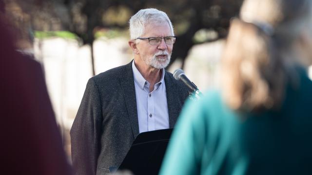 Kevin Enns-Rempel speaks during the tree planting