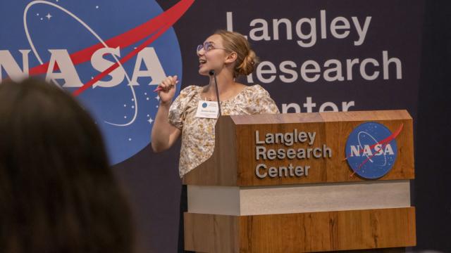 FPU student Jasmine Sirvent speaks from a podium as she presents as part of her NASA Student Airborne Research Program (SARP). 