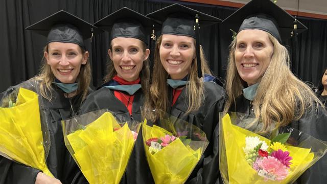 Photo taken at the graduate hooding ceremony. From left: Christa, Deanna, Bissie and Denise.