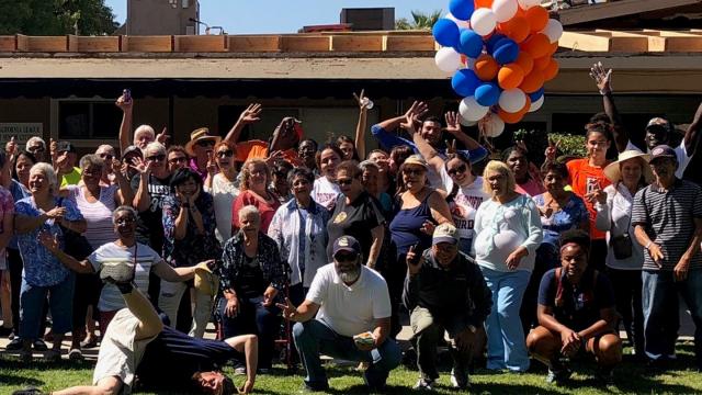 Residents of Senior Citizens Village south of the main FPU campus pose with students and staff at the Good Neighbor Block Party