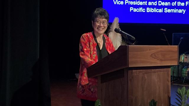 Sharon Tan at the podium