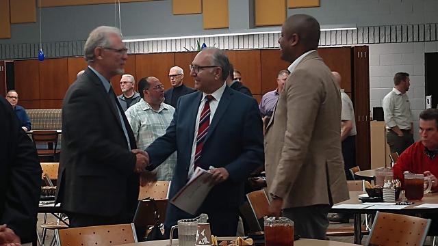 From left in photo: Randy White, Mayor Lee Brand and Matthew Grundy, former director of Habitat for Humanity Fresno County, chat at the Mayor's Faith Based Partnership Council meeting