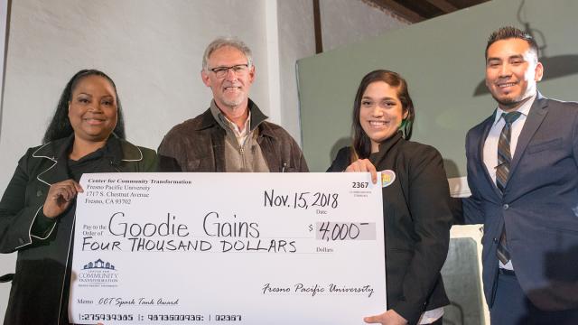 Sabrina Kelly, community relations manager, Wells Fargo; Randy White, executive director, FPU Center for Community Transformation; Gloria Leal, Goodie Gains; Carlos Huerta, CCT program director for community initiatives celebrate Goodie Gains' top prize of $4,000 at the CCT Spark Tank Pitch Fest (Photo provided by CCT)