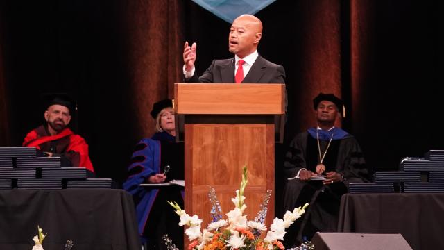 Commencement speaker Vong Mouanoutoua at the podium.