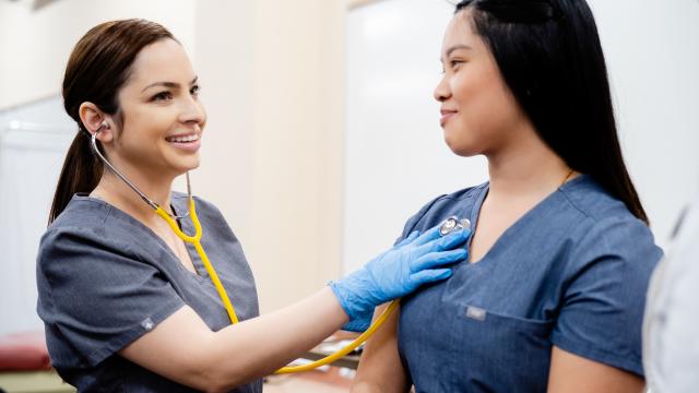 Two RN to BSN students experience hands on learning.